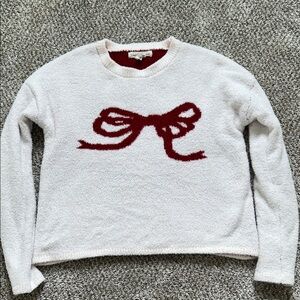 Cozy White Sweater with Red Bow Design